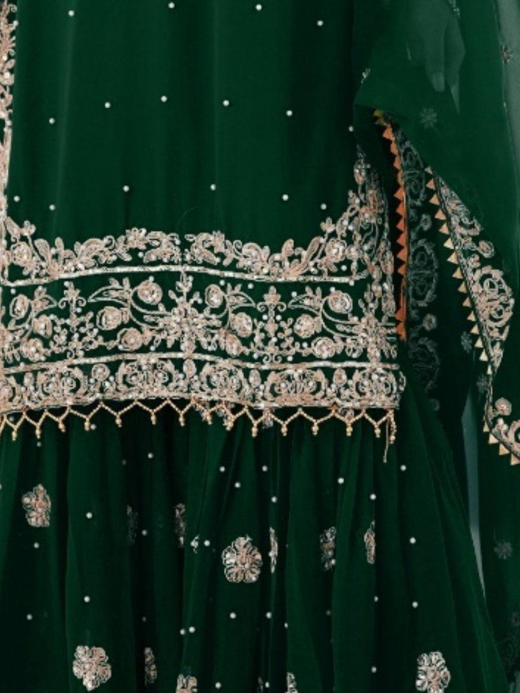 Green embroidered garment with intricate silver detailing