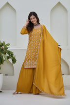 Woman wearing a yellow traditional outfit with a white background